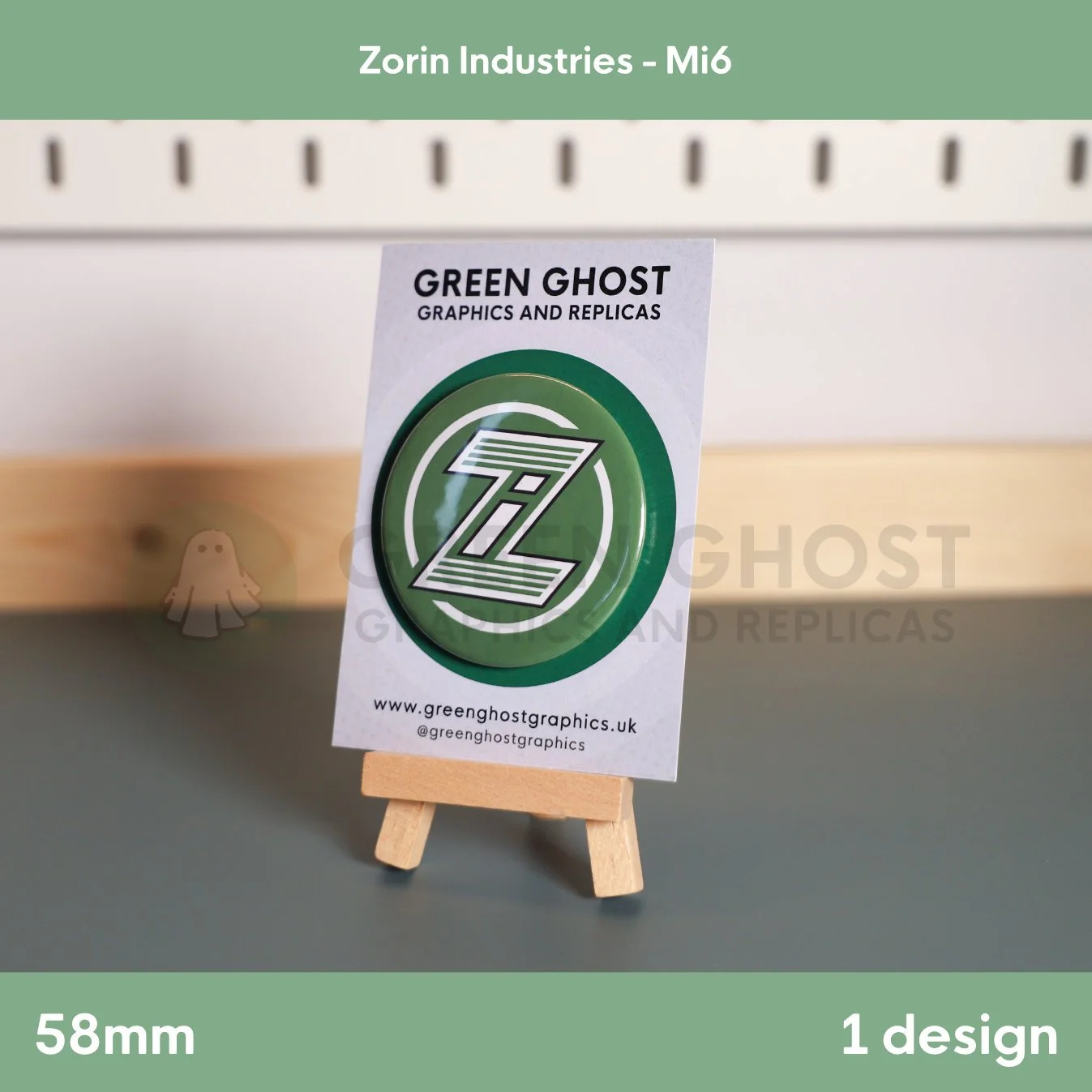 A circular green badge with a white striped “Z” design attached to a branded backing card.