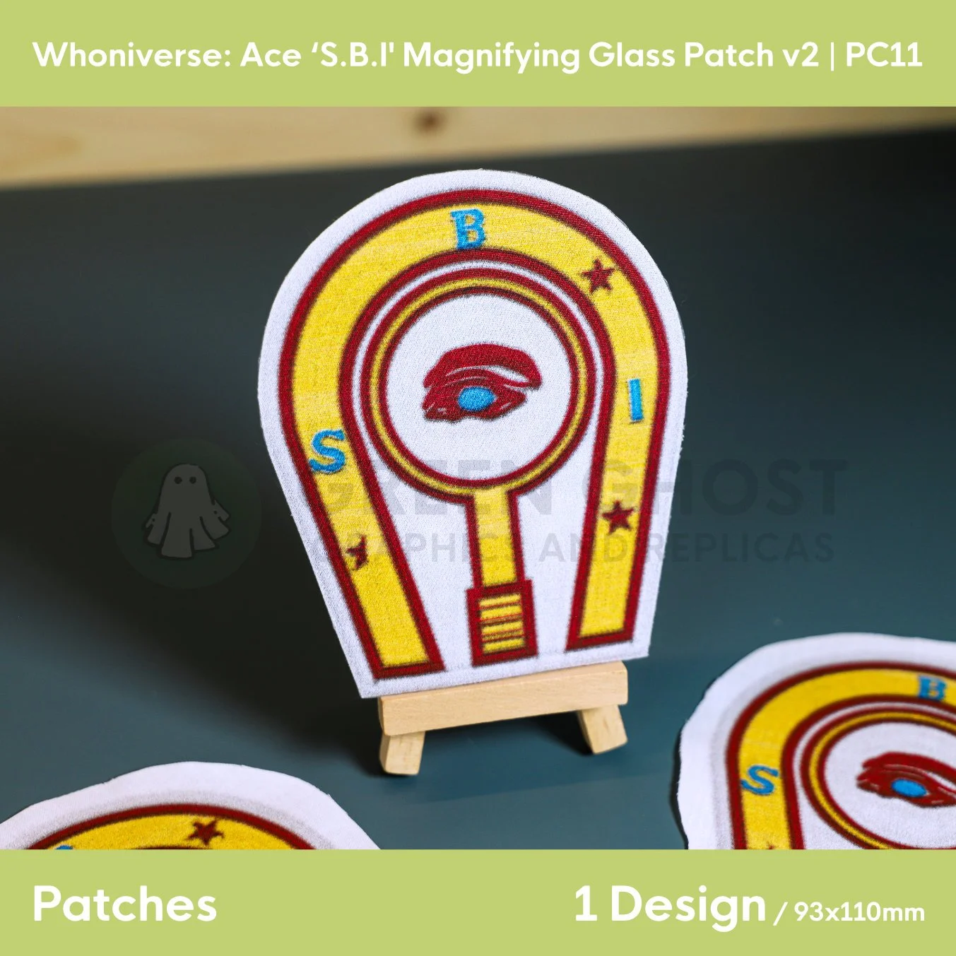 Close up of the finished version 2 horse shoe patch on a small easel on a aqua green background.