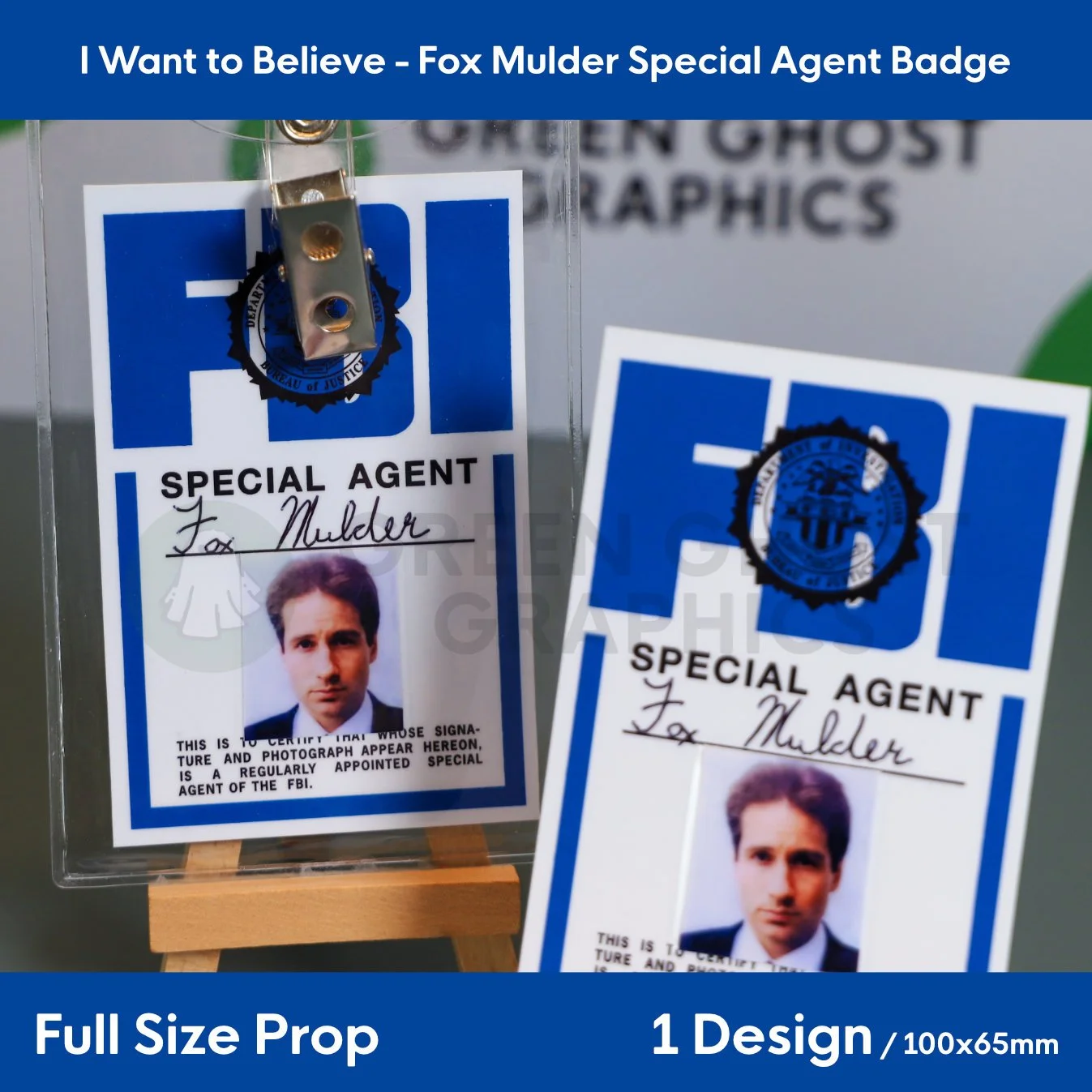 A clear plastic badge holder containing a blue and white “SPECIAL AGENT Fox Mulder” ID card displayed next to a matching credential card on an easel.