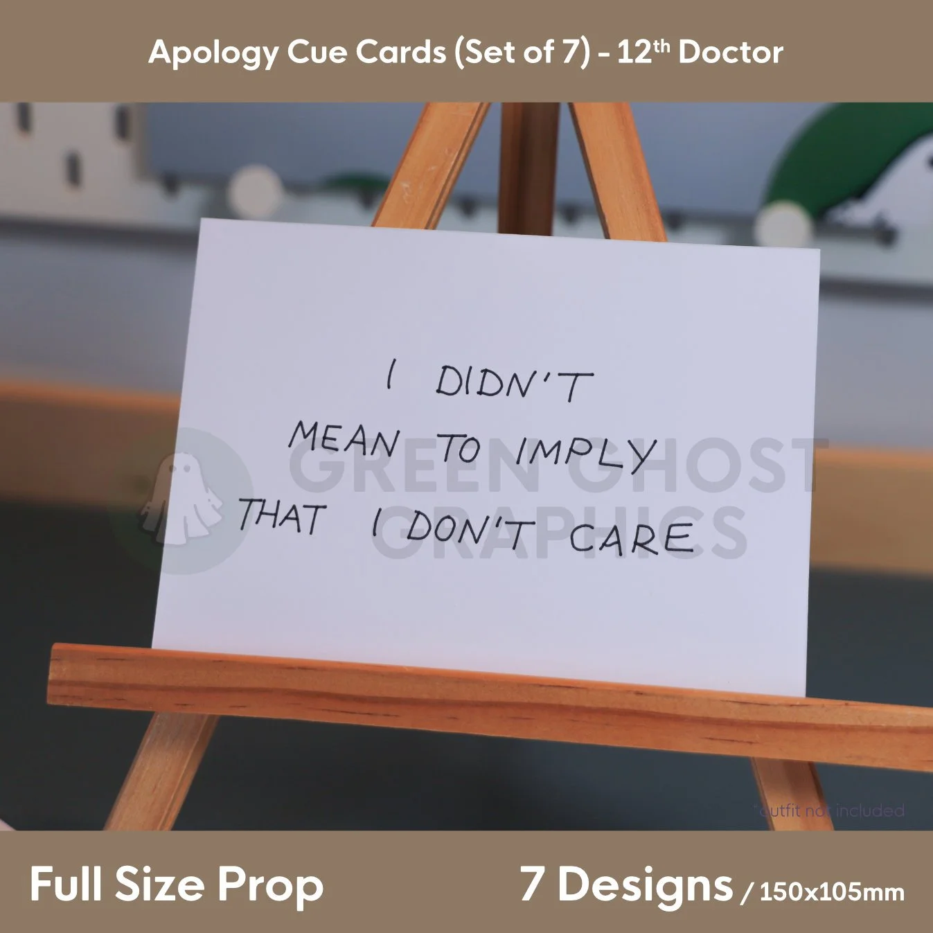A white rectangular cue card reading “I DIDN'T MEAN TO IMPLY THAT I DON'T CARE” displayed on a small wooden easel.