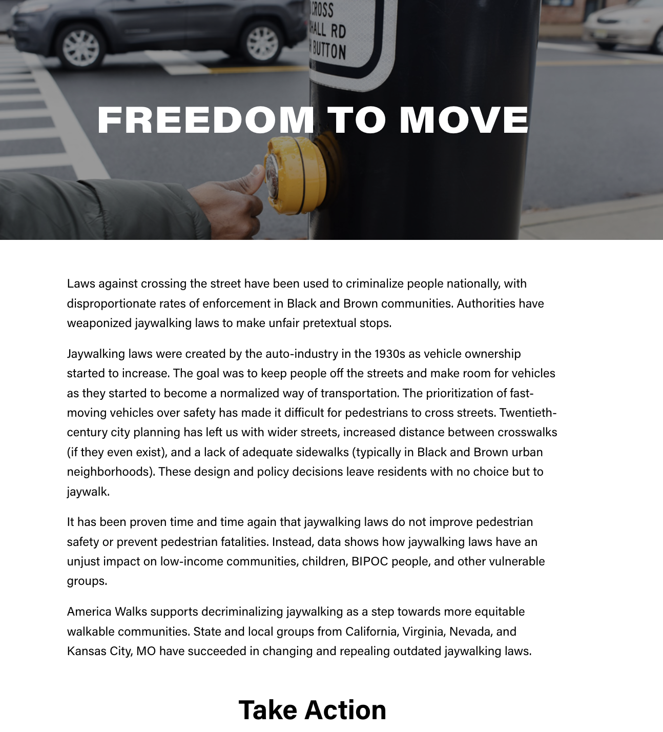 A hand pressing a crosswalk button on a street pole with the text "Freedom to Move" overlaid in bold white letters