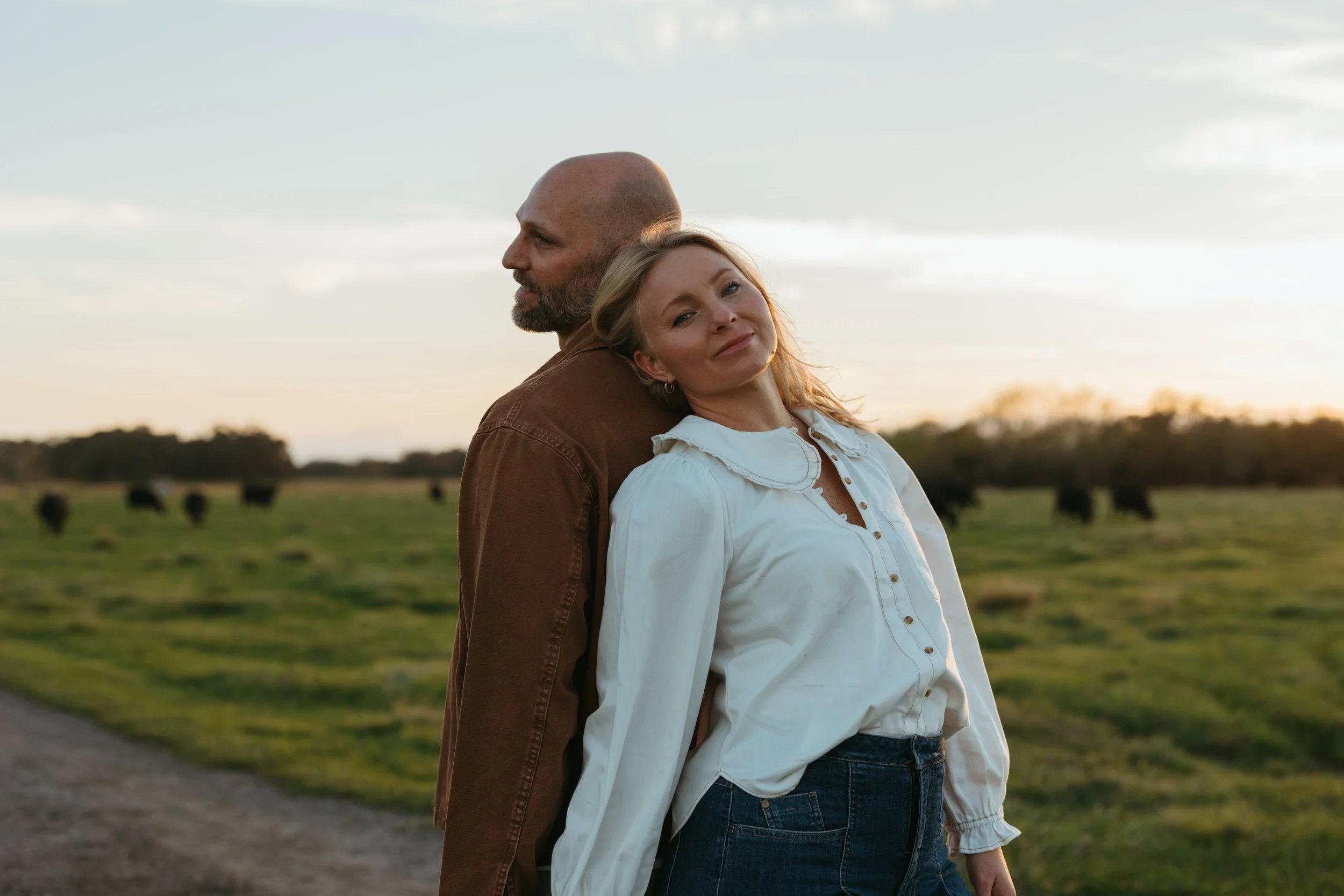 a mother and father pose for a lifestyle session at home in st.cloud florida