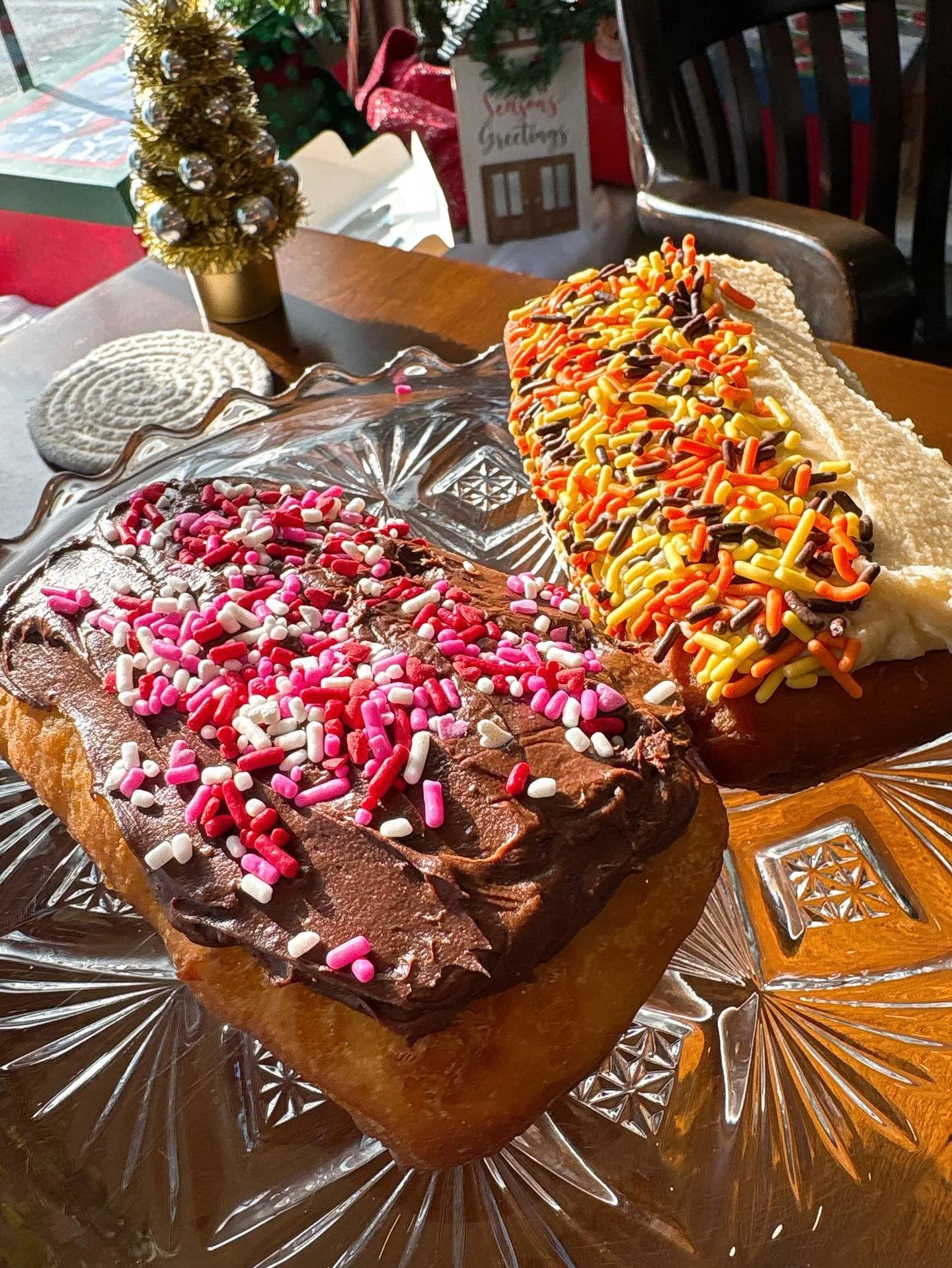 DONUTS!! Chocolate frosted and Maple frosted, on a fluffy housemade donut, with yummy crunchy sprinkles. Get them while they last!  We have NEW HOURS TOO! Wednesday-Monday 8am-3:30pm. #thesugarchalet #wilbraham #westernmass #donuts #sprinkles new