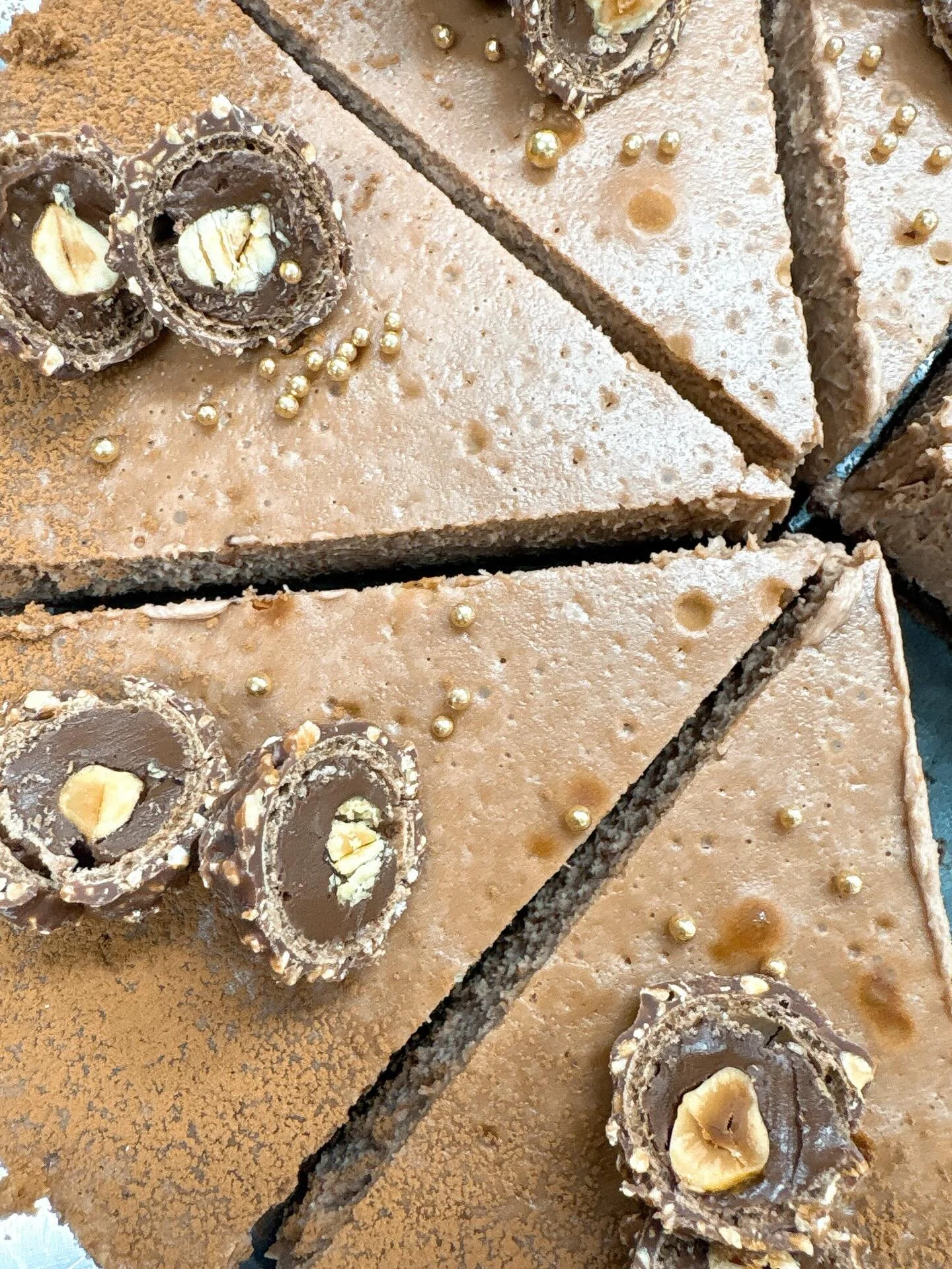 Ferrero Rocher cheesecake!!! Chocolate crust, creamy hazelnut chocolate cheesecake, dusted with cocoa powder and topped with a whole Ferrero😋😋. Come try a slice! And remember we are closed on Mondays and Tuesdays #thesugarchalet #wilbraham #western