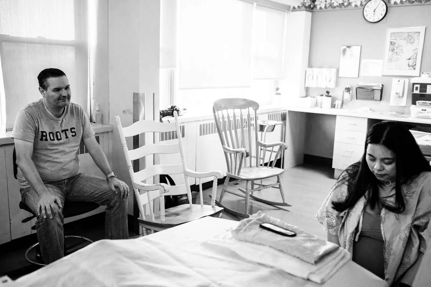 Ottawa mom in labour at hospital while Dad looks at her lovingly.