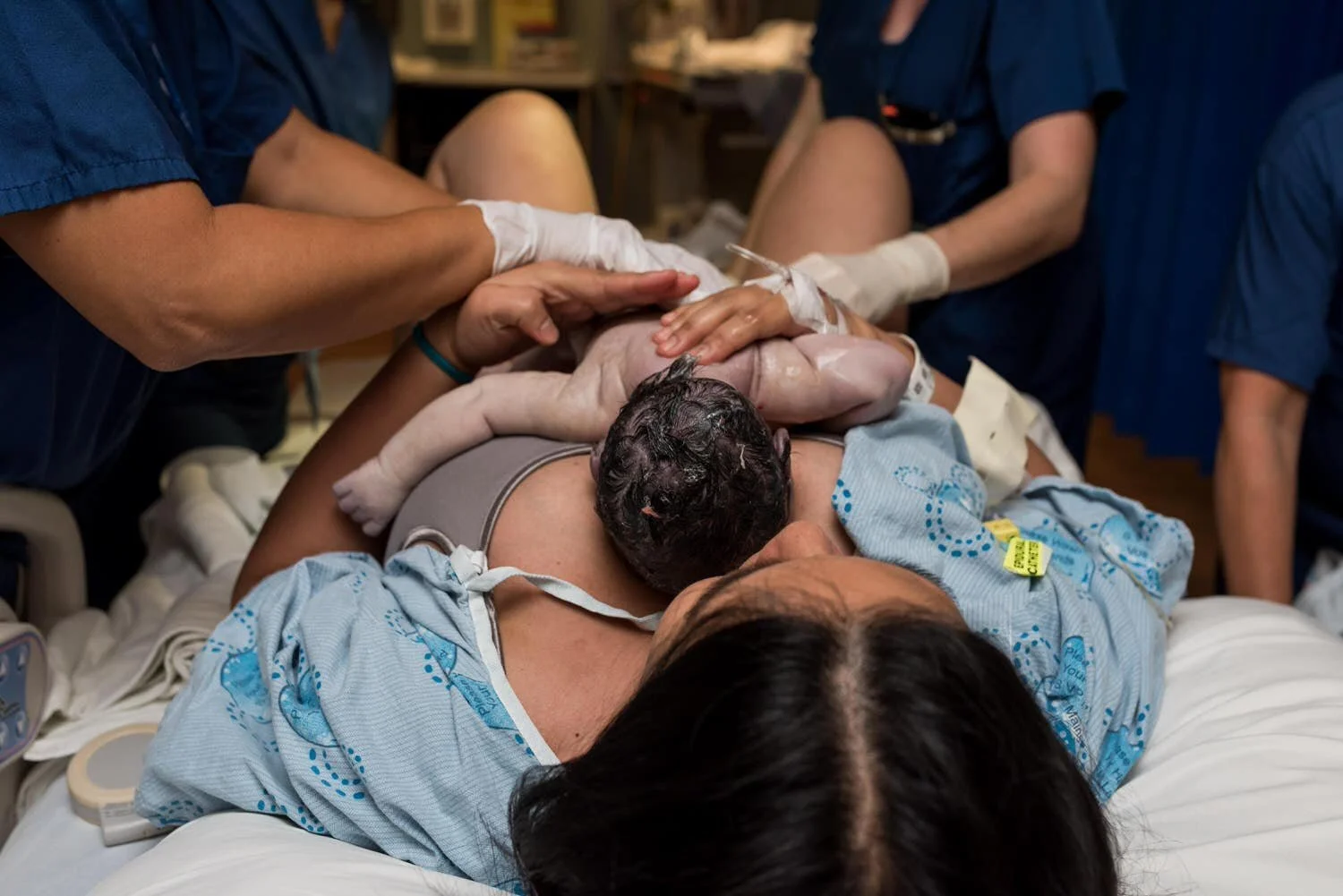 Brand new baby just born into mom's hands at civic hopsital in Ottawa. He is healthy and beautiful.