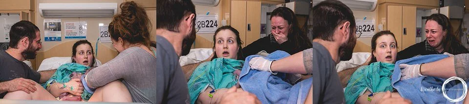 Mom completely surprised when her baby is born at Montfort Hospital. Her eyes are wide and her mouth is open in disbelief. Her best friend, midwife, and husband surround her.