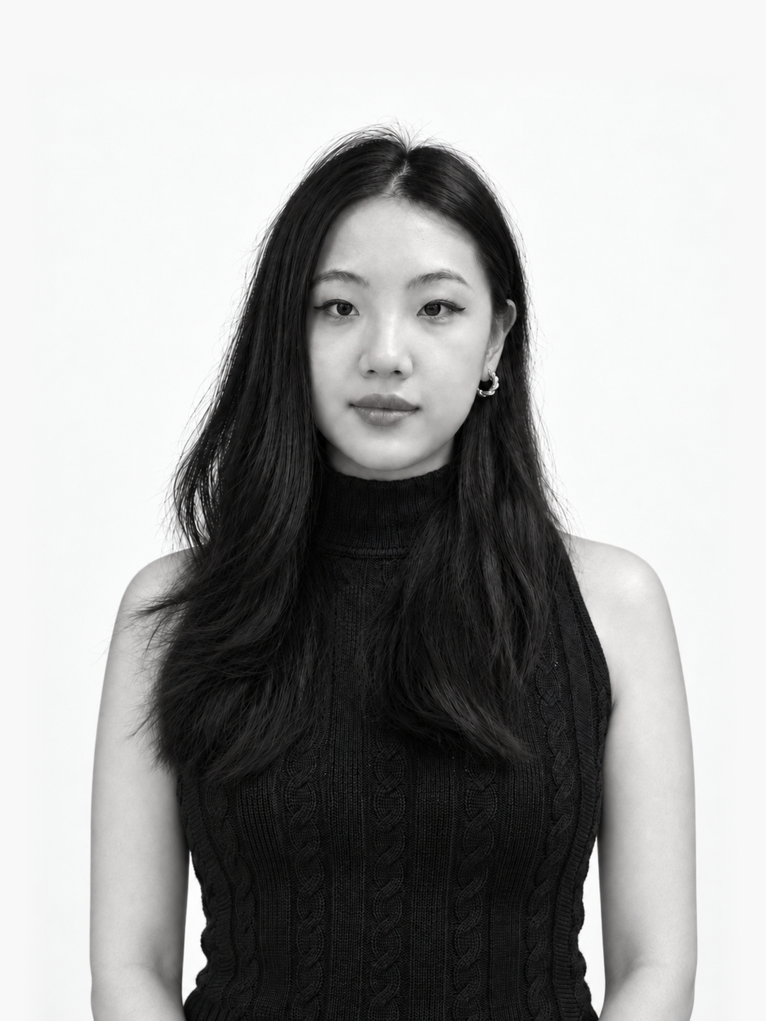 Black-and-white portrait of Lucille He against a light studio-style background