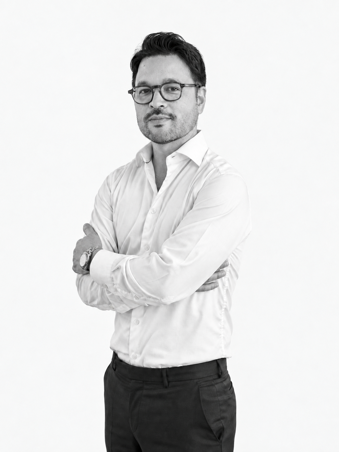 Black-and-white portrait of José Ton against a light studio background