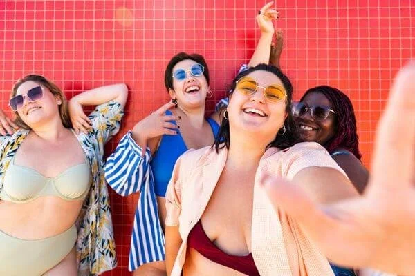 group of women in swimwear having fun