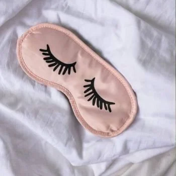 light pink sleeping eye mask with eyelashes