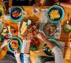 aerial view of group eating pasta