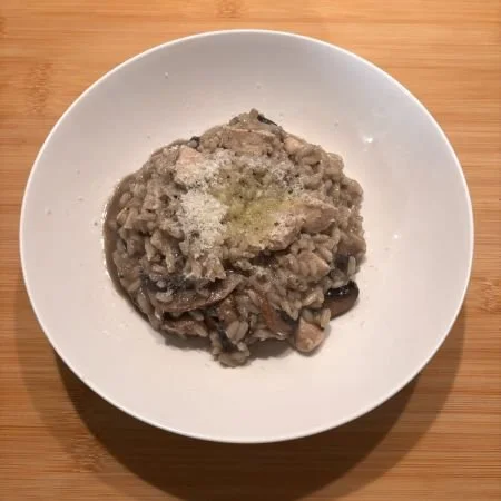 chicken mushroom risotto in white bowl