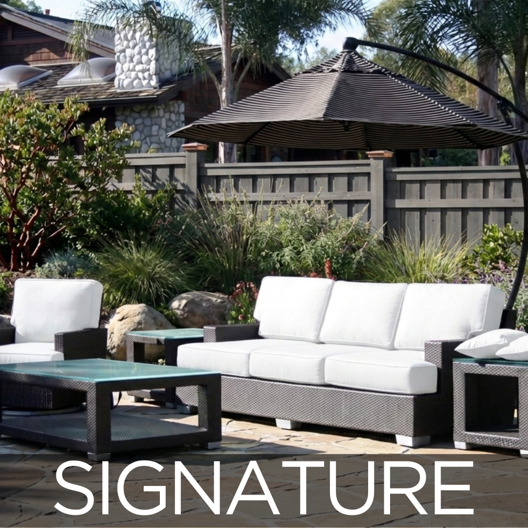 Signature Patio Set featuring dark brown wicker and white cushions. Cantilever umbrella is over the whole set.