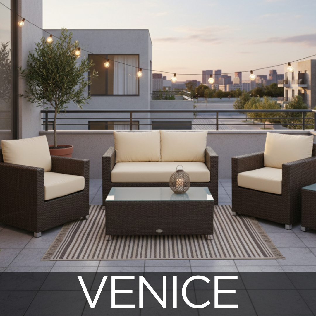 Venice collection is a dark brown resin wicker patio set. It is on a outdoor condo balcony with string lights. Beige sunbrella cushions. 