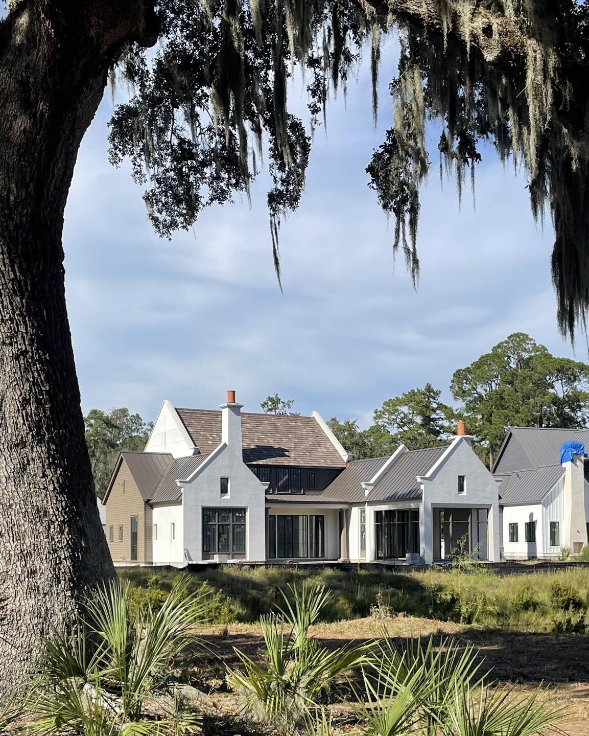 Water and live oak views from these porches on a beautiful Friday.

General Contractor: @pr_homesbluffton

#residentialarchitecture #customhome #palmettobluff #porch
