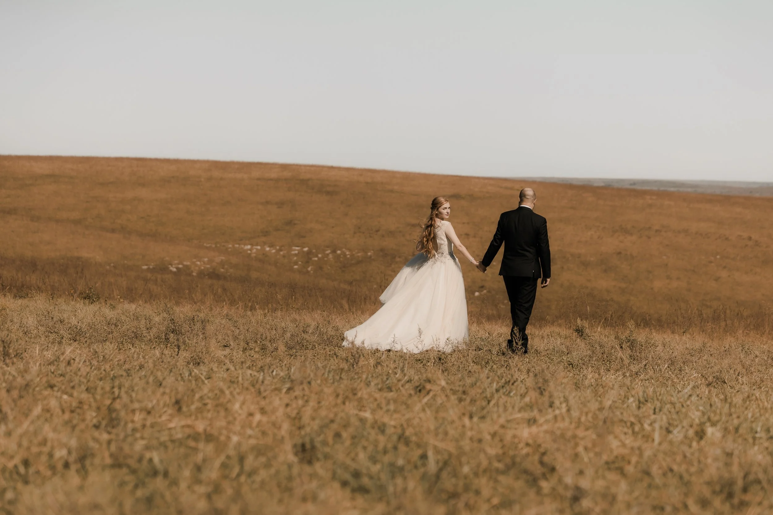 Manhattan KS wedding photographer capturing genuine emotion and natural light portraits for weddings and engagements in Manhattan, Kansas.