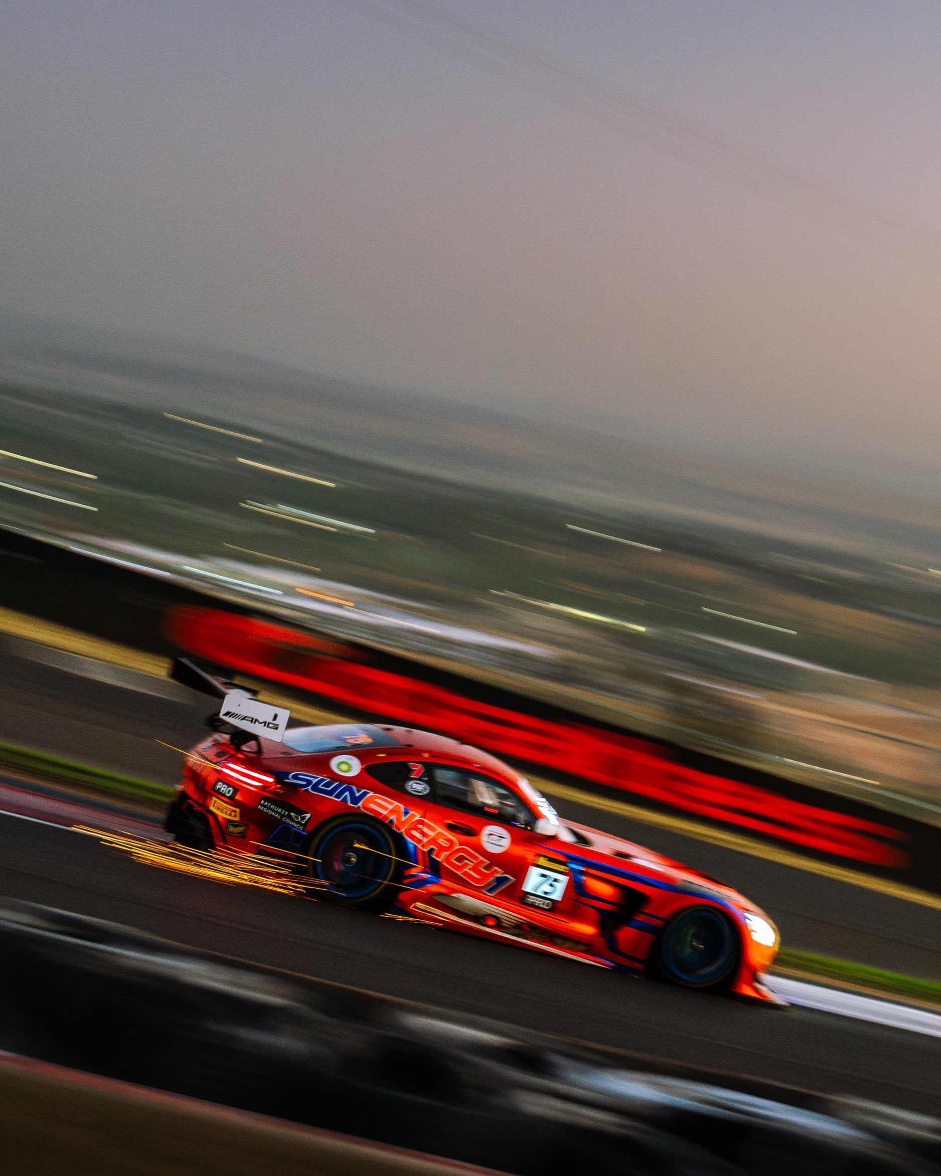 The SunEnergy1 Racing Mercedes-AMG GT3 throws sparks as it bottoms out through the Esses during the pre-dawn 2025 Bathurst 12 Hour.