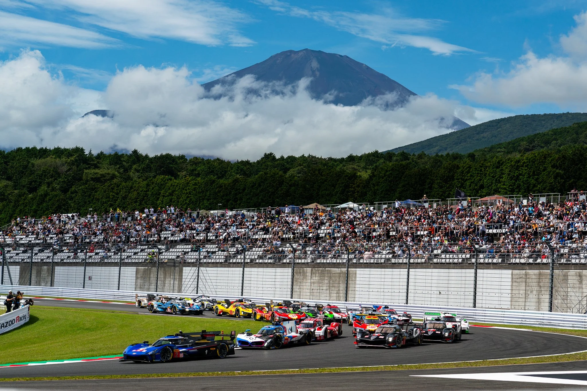 Race start at the 2024 World Endurance Championship round at Fuji Speedway as the Hypercars enter turn 1.