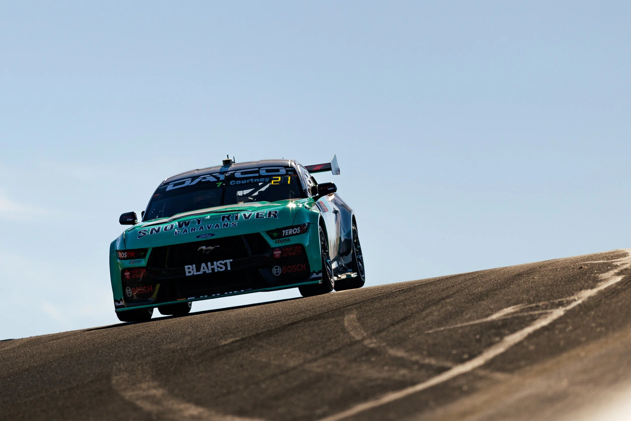 Blanchard racings James Courtney aboard their Ford Mustang Supercars car as it passes over Skyline at the 2025 Bathurst 1000.