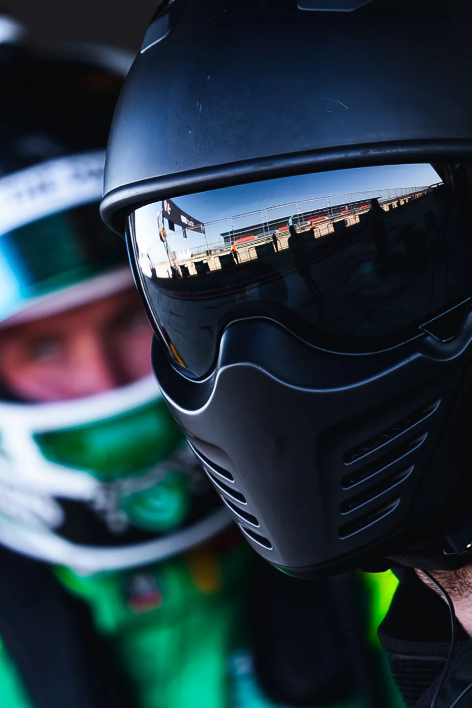 Volonte Rosso pit crew member with a reflection of the pit lane on the viser with Liam Talbot in the background during the 2025 The Bend GT World Challenge Australia round.