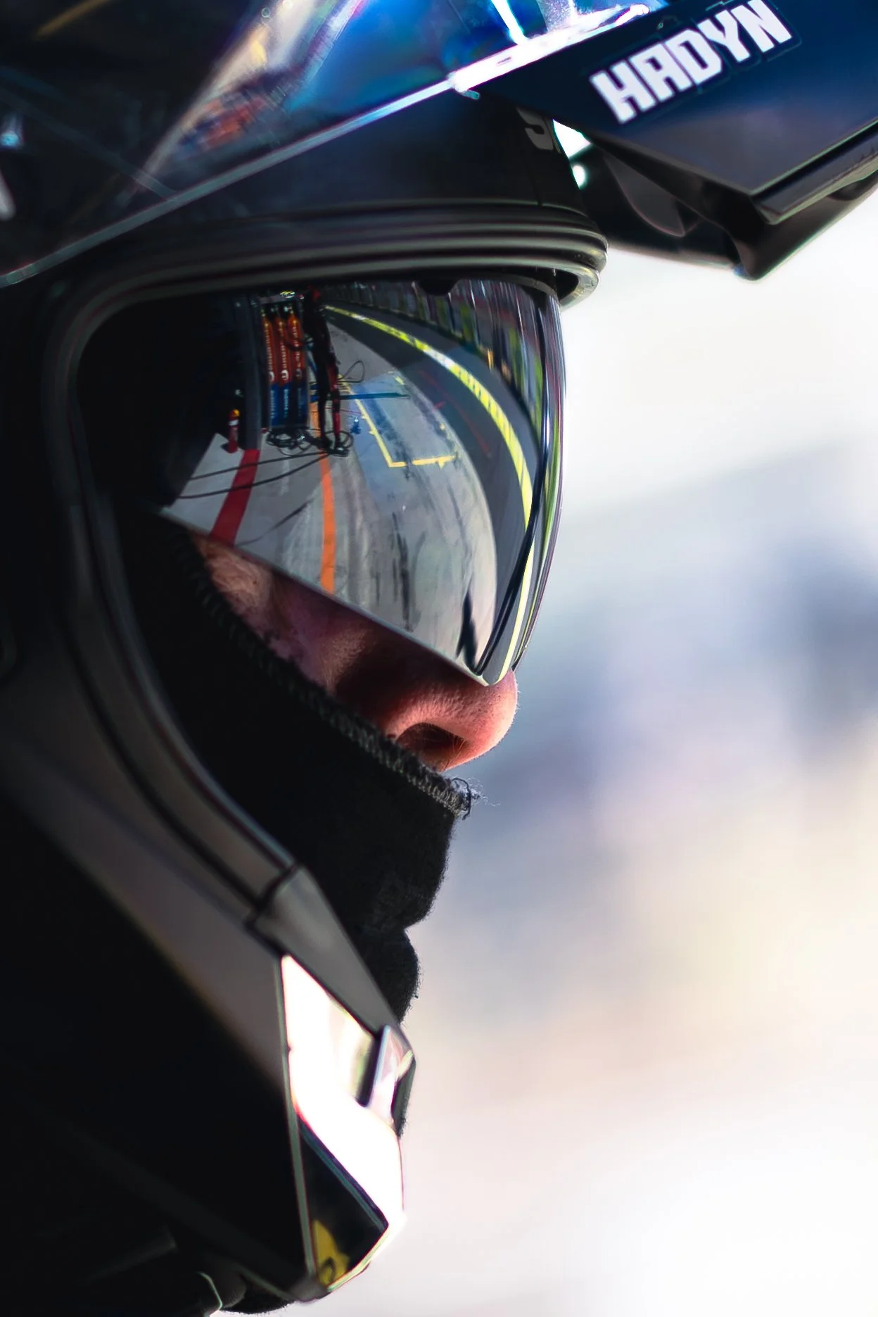 A close up of a Brad Jones Racing mechanic looking into pitlane at the 2025 Bathurst 1000.