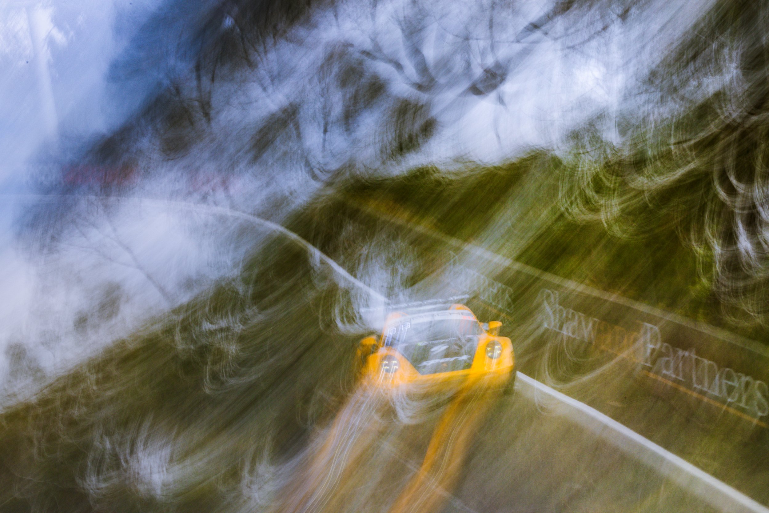 Whip-pan motion blur resembling an oil painting of the Absolute Racing Porsche 911 GT3 R at the 2025 Bathurst 12 Hour.
