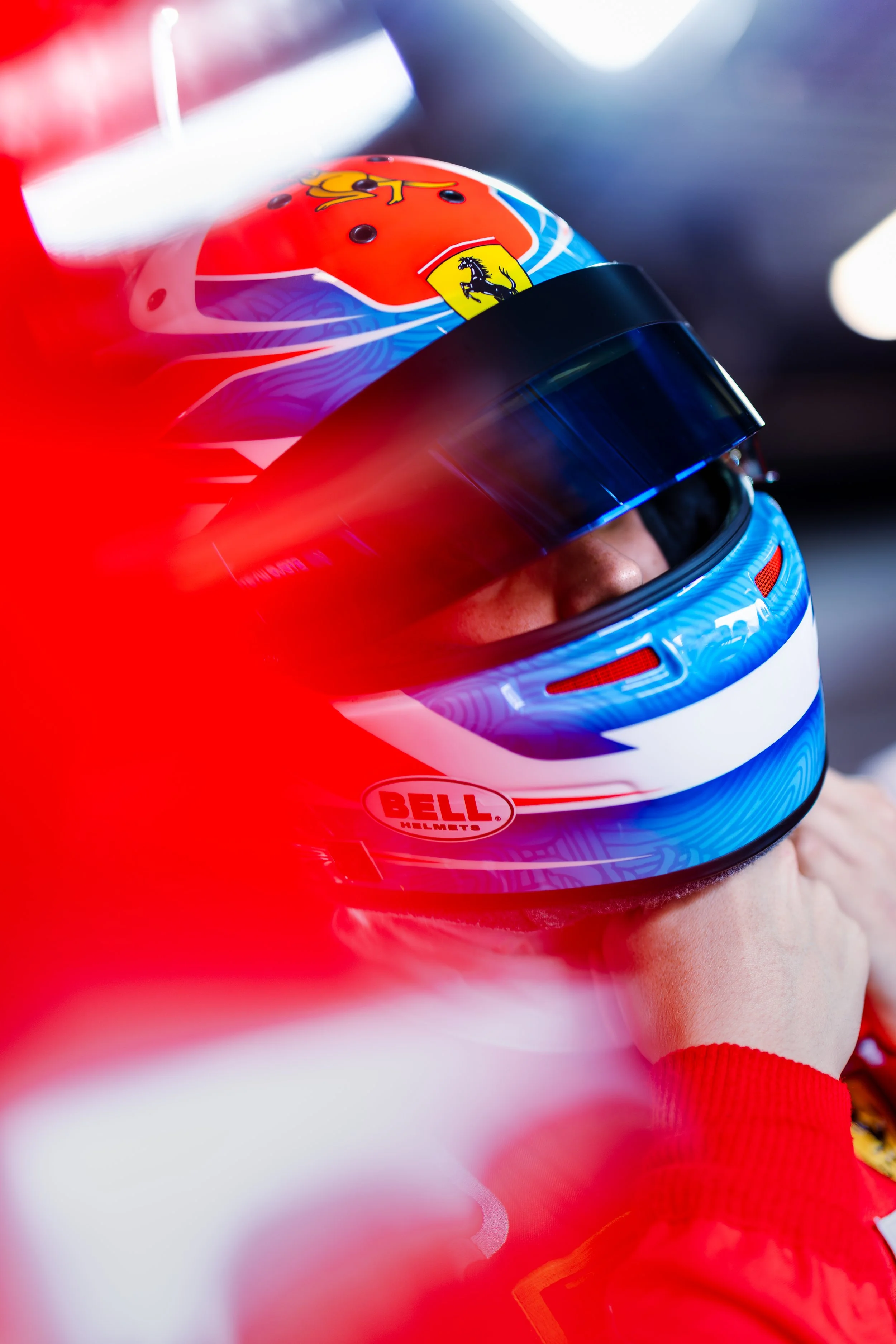 Close-up of Jordan Love putting on his helmet before entering the Arise Racing GT Ferrari GT3 at The Bend during the GT World Challenge Australia round