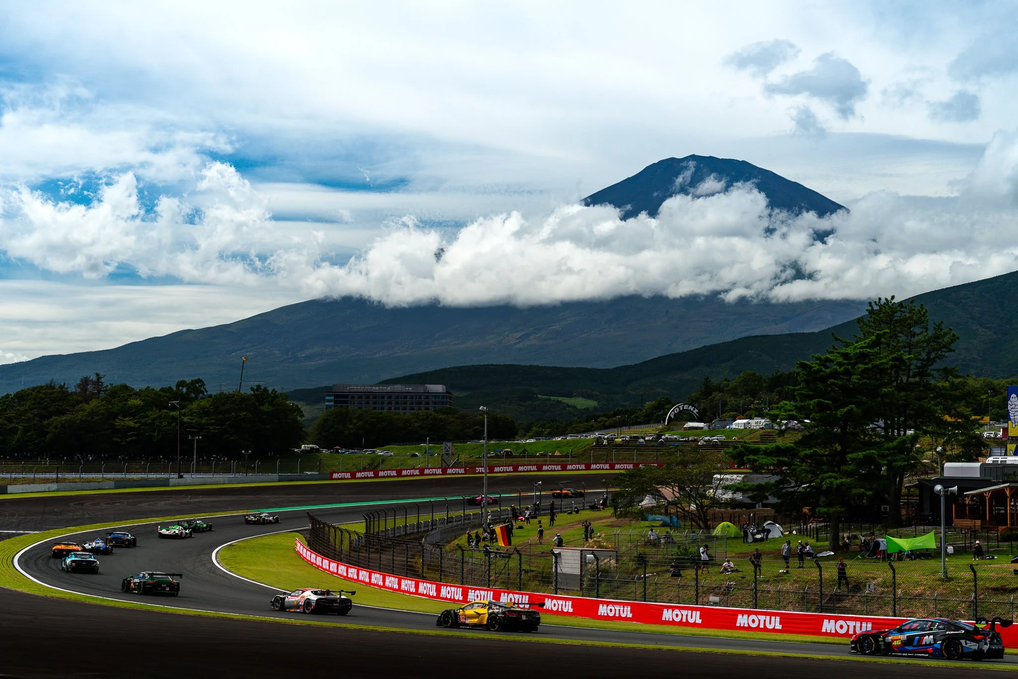 The field passing through turn 8 at Fuji Speedway with Mt Fuji in the background at the 2024 World Endurance Championship.