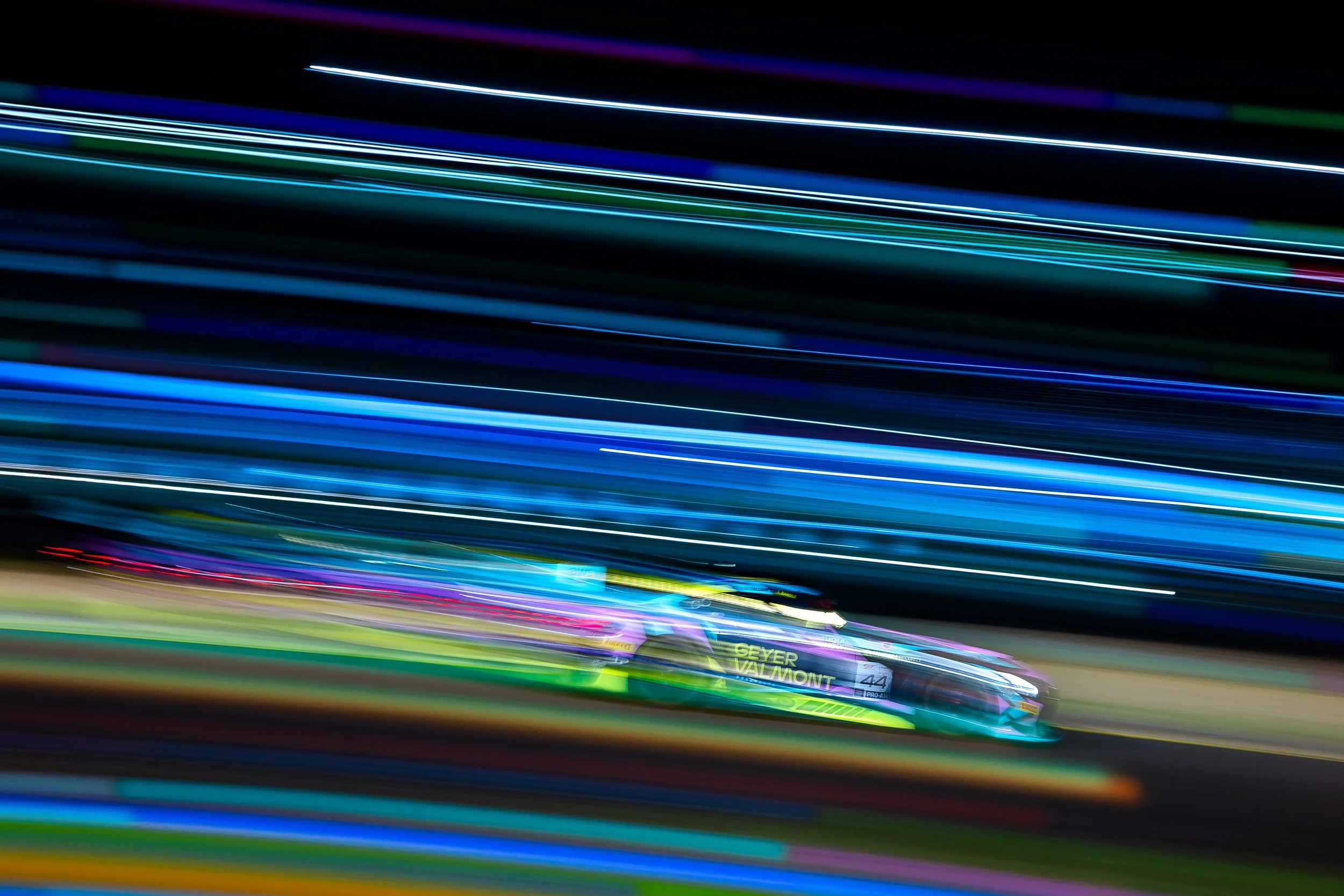 Tigani Motorsport Mercedes-AMG GT3 captured in a whip-pan shot passing through fairy lights during the 2025 GT World Challenge Australia round at Sydney Motorsport Park.