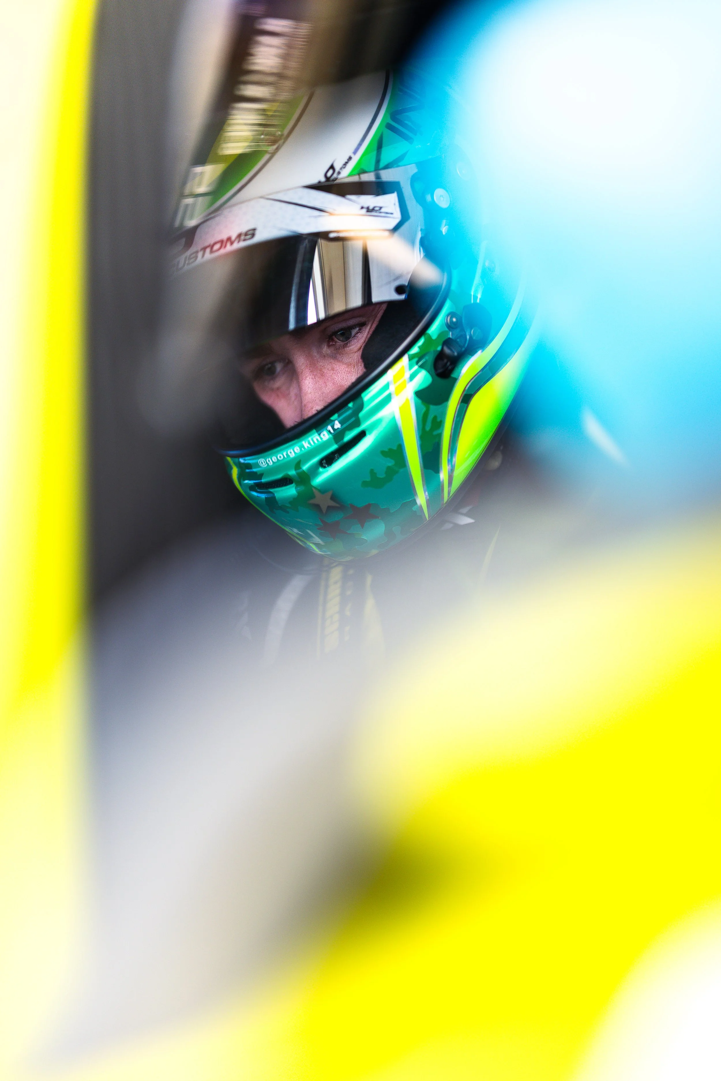 George King in the Tigani Motorsport Mercedes-AMG GT3 looking focused before leaving the pit lane, with reflections visible on the window during the 2025 GT World Challenge Australia season.