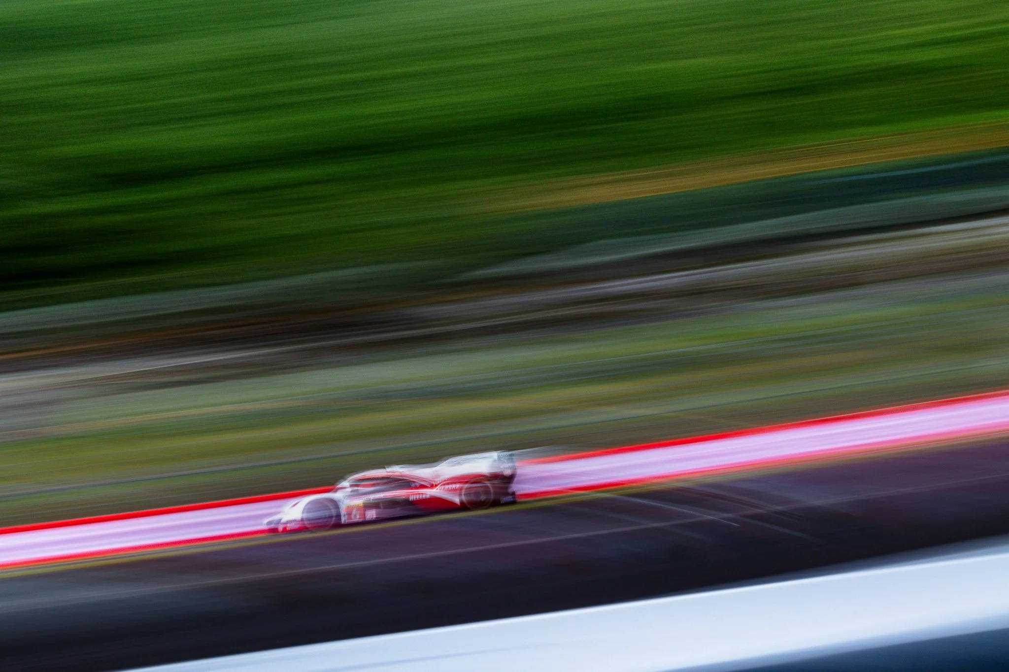 Porsche Penske 963 #5 captured in a whip-pan shot during the 2024 World Endurance Championship round at Fuji Speedway.