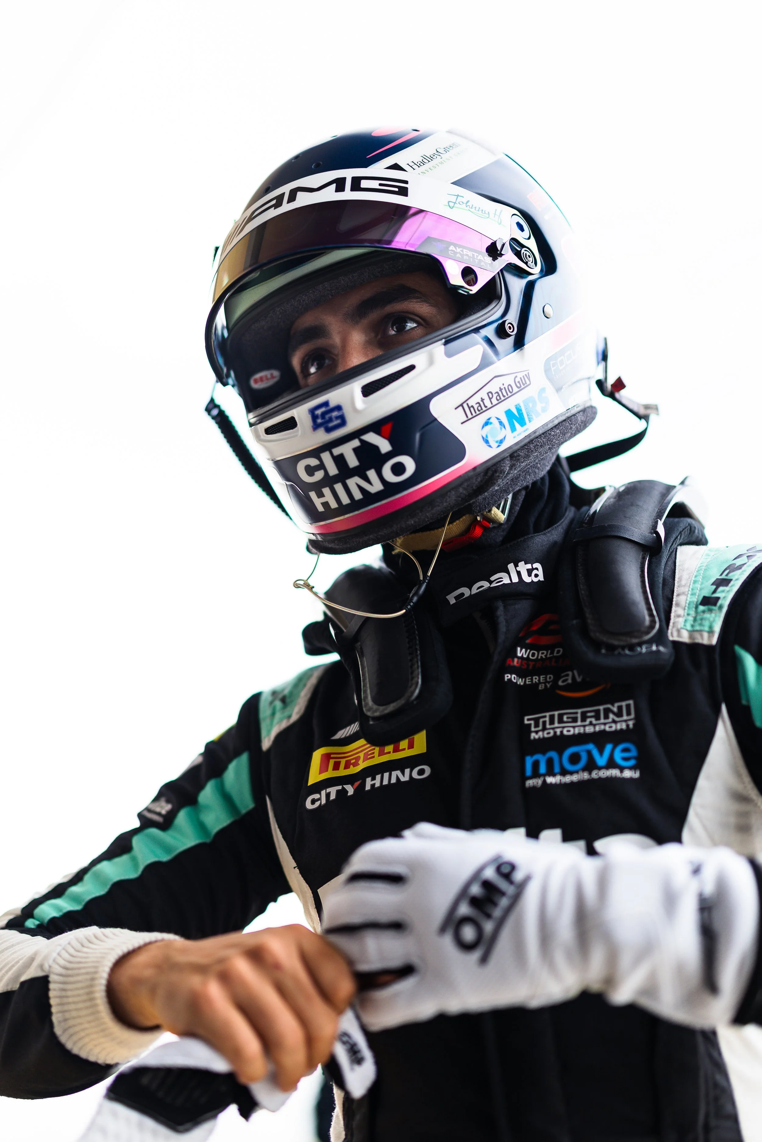 Jayden Ojeda pulling off his gloves after a stint in the Tigani Motorsport Mercedes-AMG GT3 during the 2025 GT World Challenge Australia season.