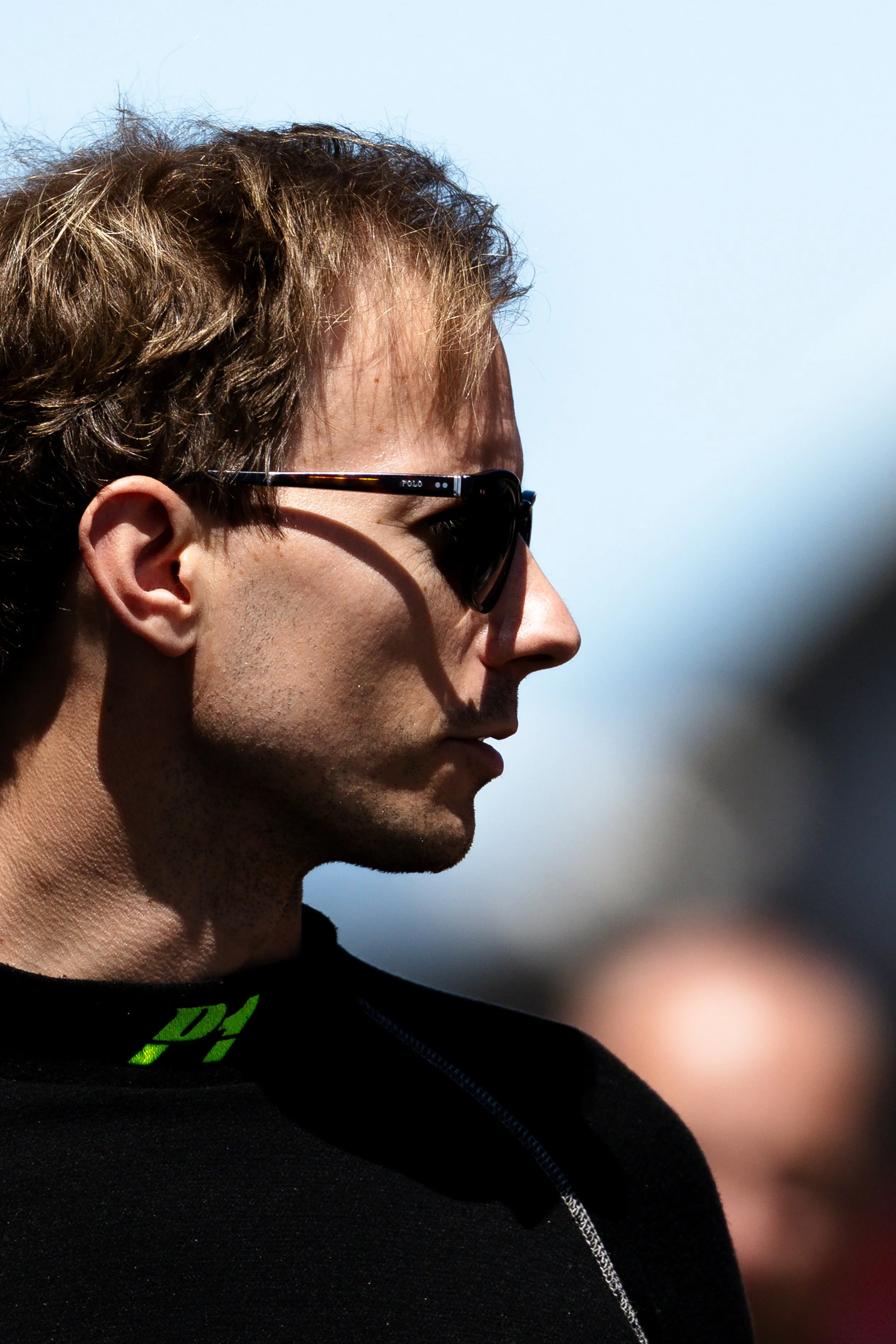 Josh Buchan from Zagame Motorsport with shadowing on face from late afternoon sun. 