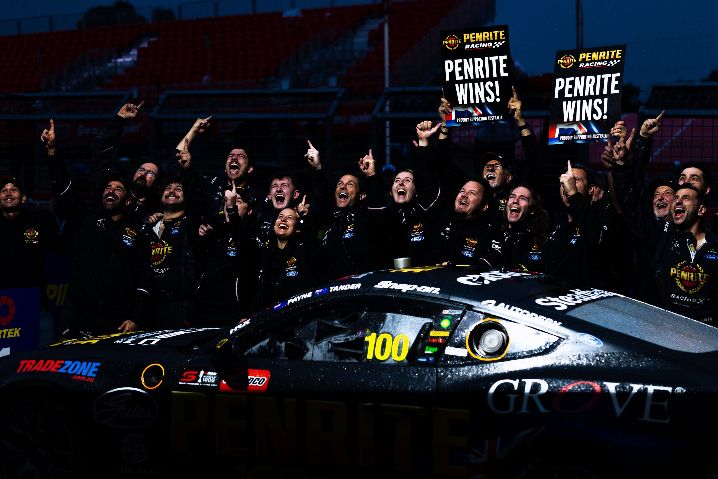 Penrite Grove Racing team celebrate their 2025 Bathurst 1000 victory in pit lane.