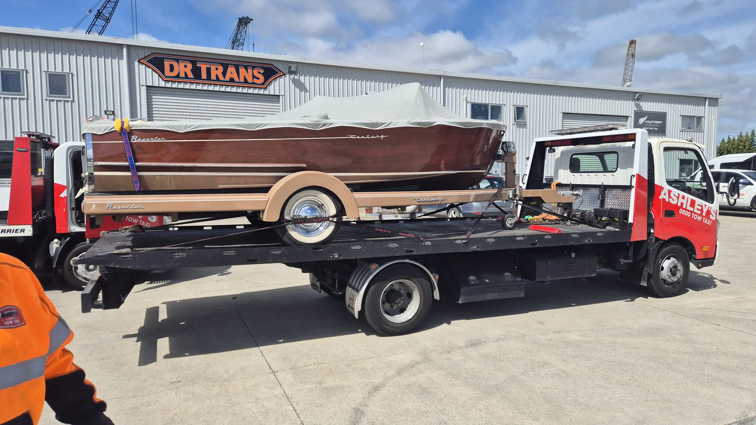 classic boat getting towed to Christchurch