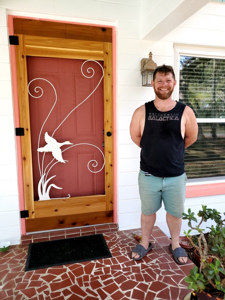 Custom door with salvaged metal decoration (and me!)