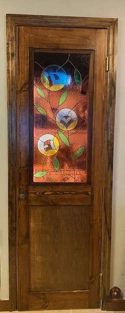 Pantry door with inset stained glass