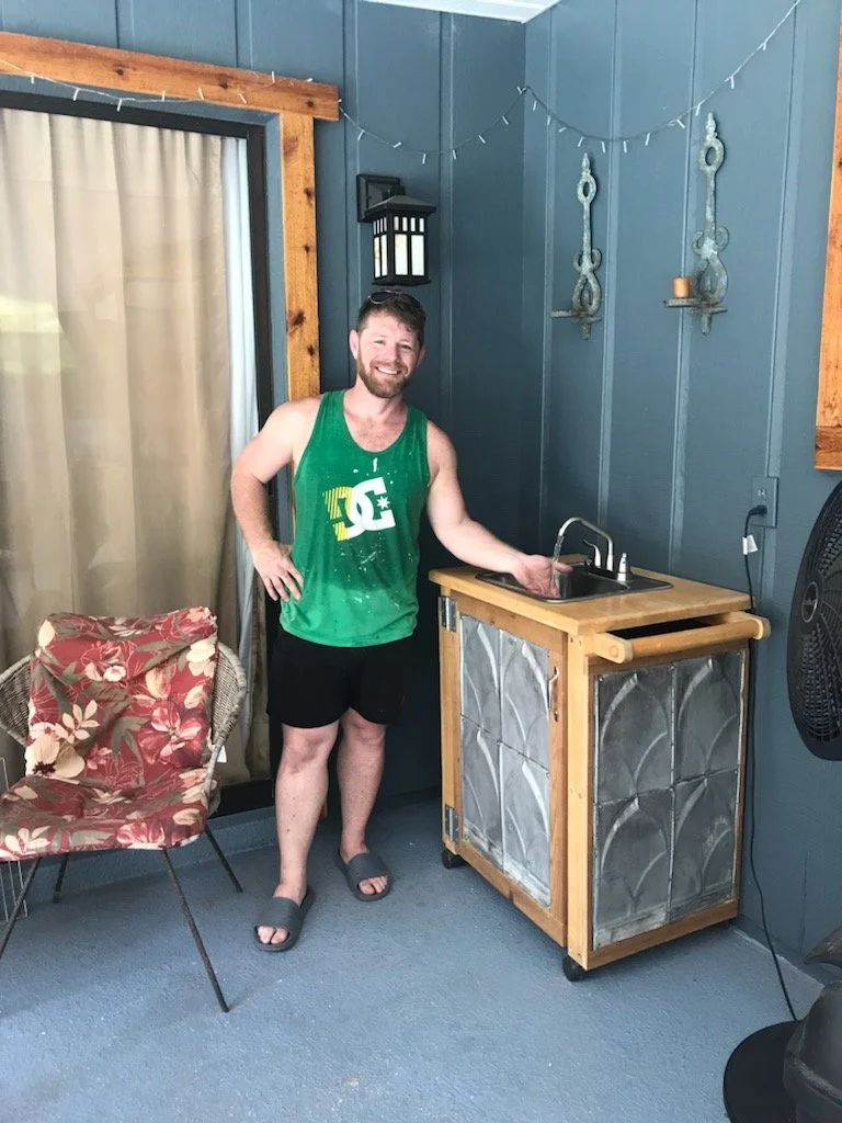 Poolside sink with architectural salvage (metal roof panels from historic downtown Deland)