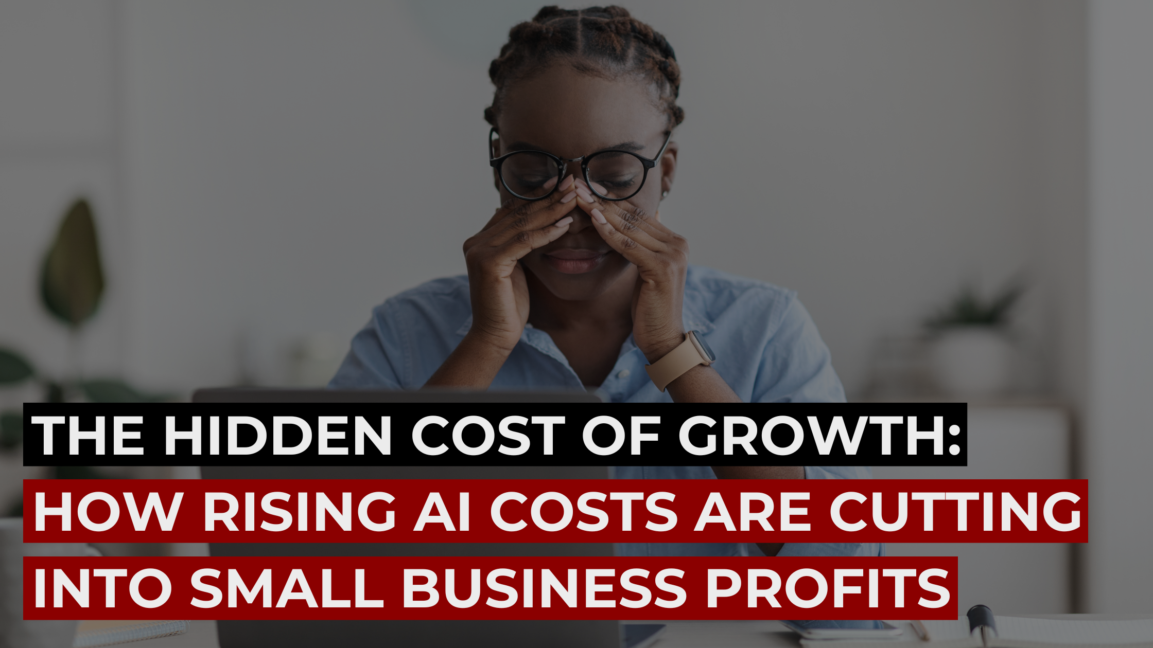 Stressed business owner at laptop with headline about rising AI costs cutting small business profits