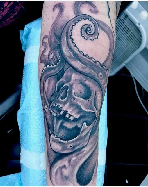 black-grey-skull-with-tentatacles-forearm-tattoo-treasure-island-fl.jpg