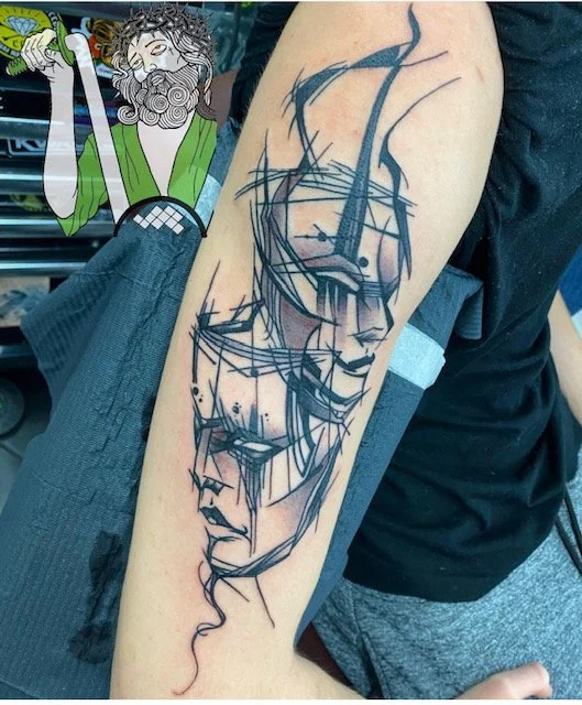 black-grey-faces-arm-tattoo-treasure-island-fl.jpg