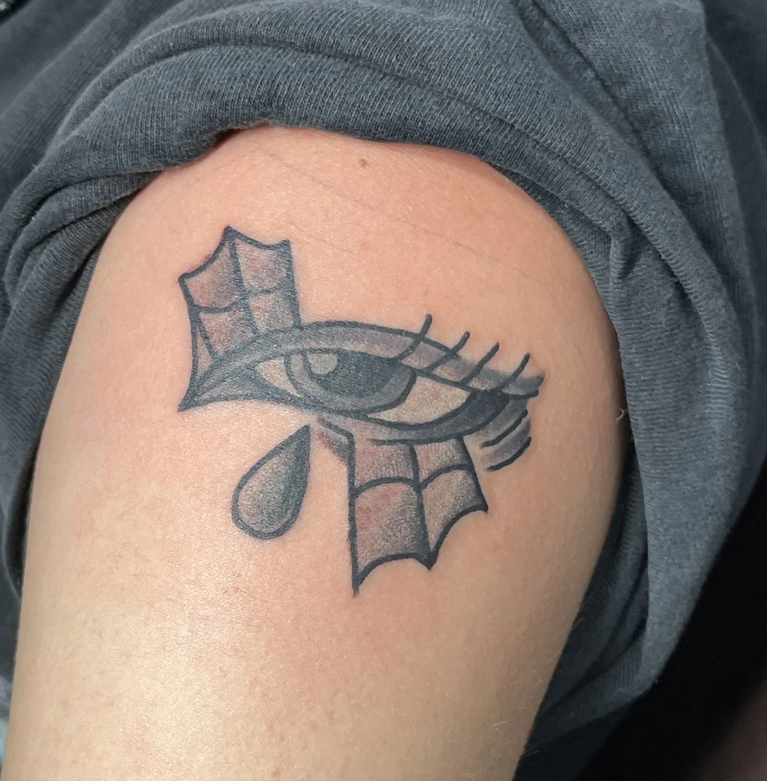 black-grey-eye-shoulder-tattoo-treasure-island-fl.jpeg