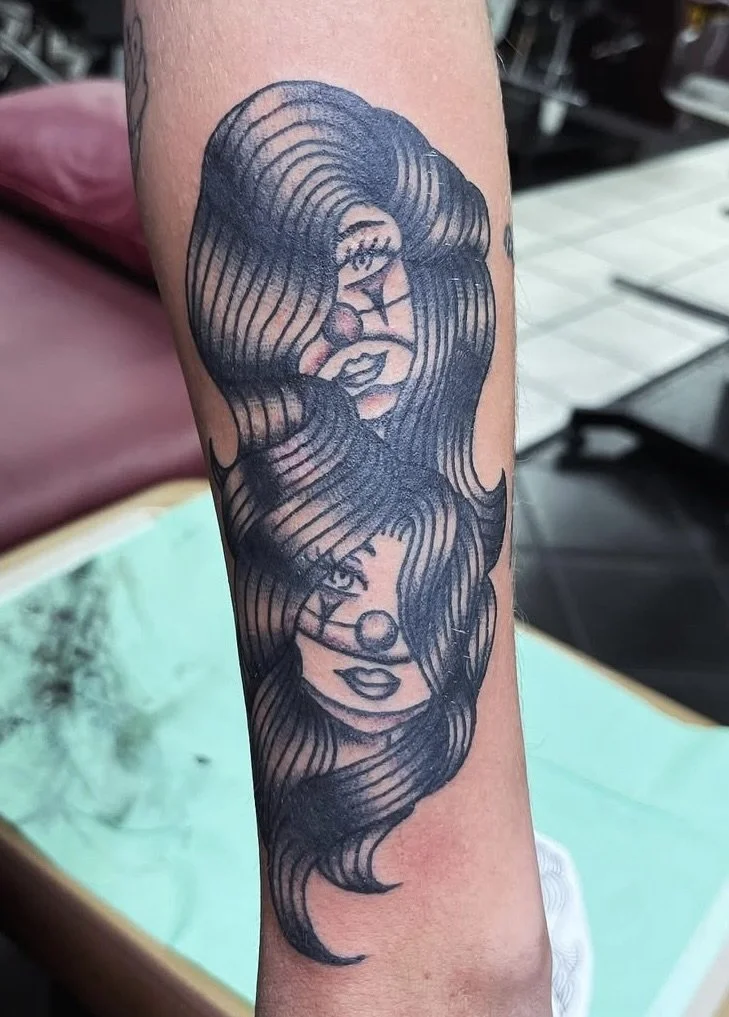 black-grey-female-clowns-forearm-tattoo-treasure-island-fl.jpg