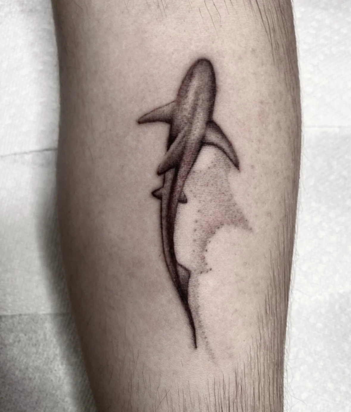 black-grey-realism-shark-leg-tattoo-treasure-island-fl.jpg