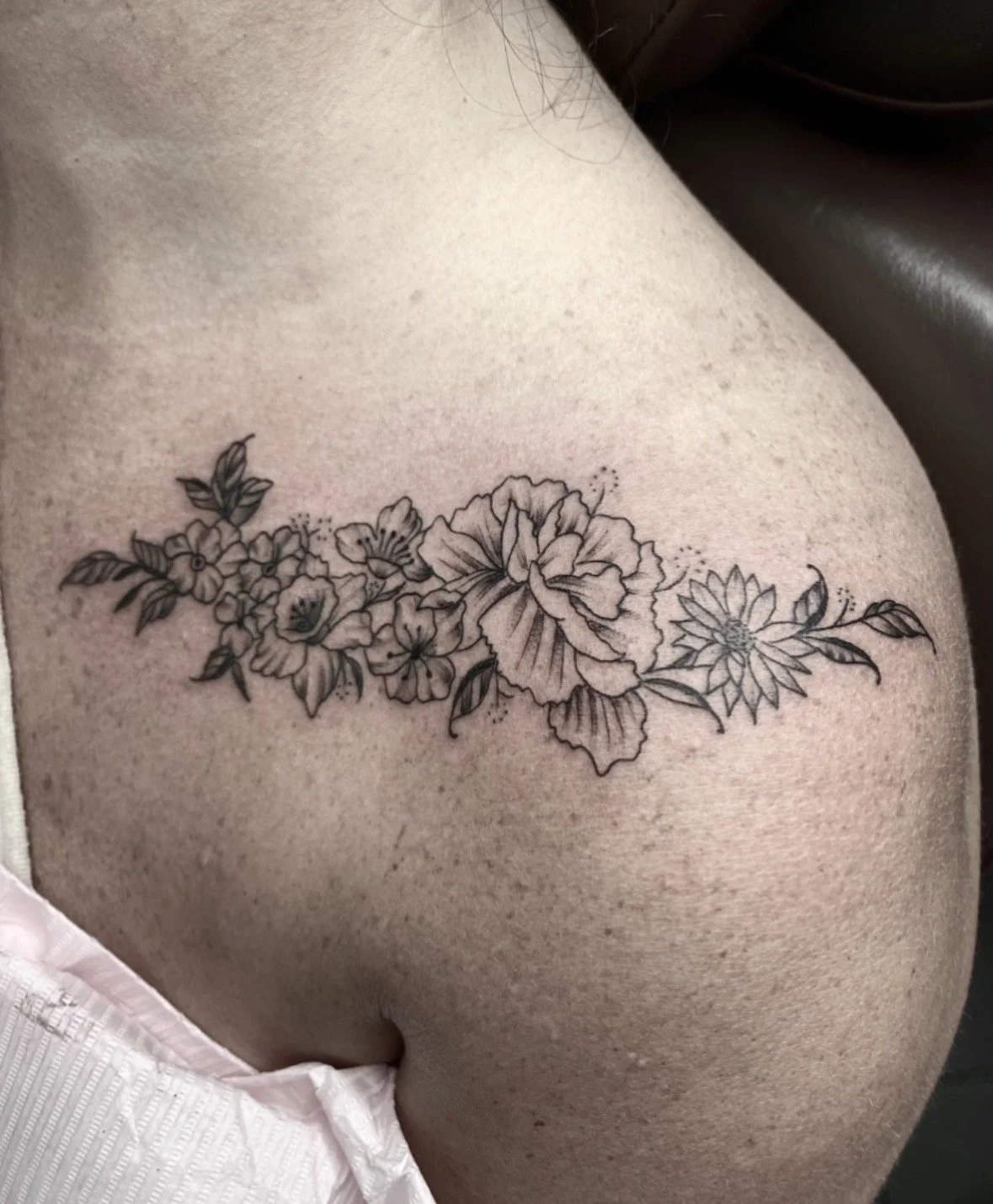 black-grey-realism-flowers-shoulder-tattoo-treasure-island-fl.jpg