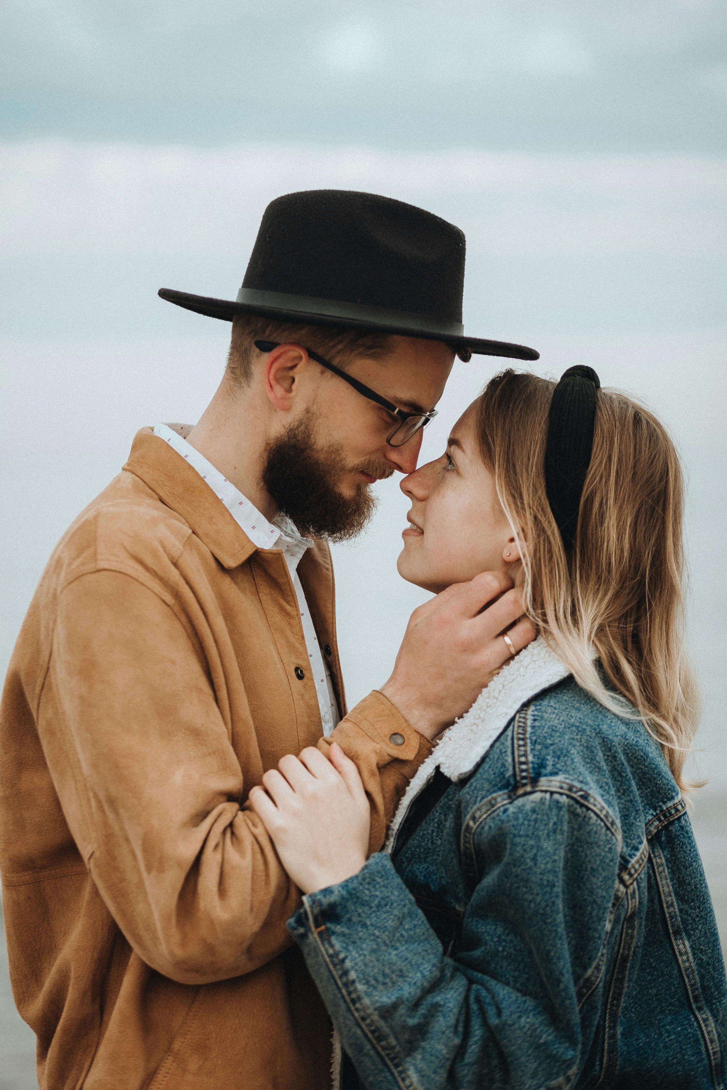 A man and woman look longingly into each others eyes. The me and we method helps couples balance individuality and togetherness for deeper connection. A relationship therapist in Berkeley, CA can help you find that balance.