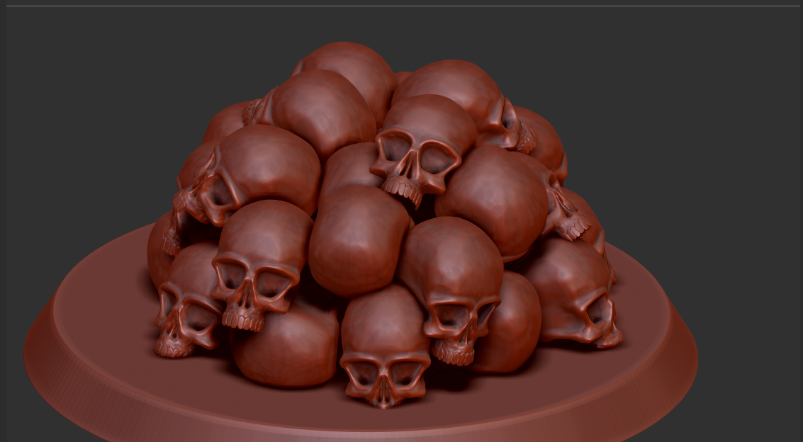 A sculpture of a pile of human skulls on a round base.