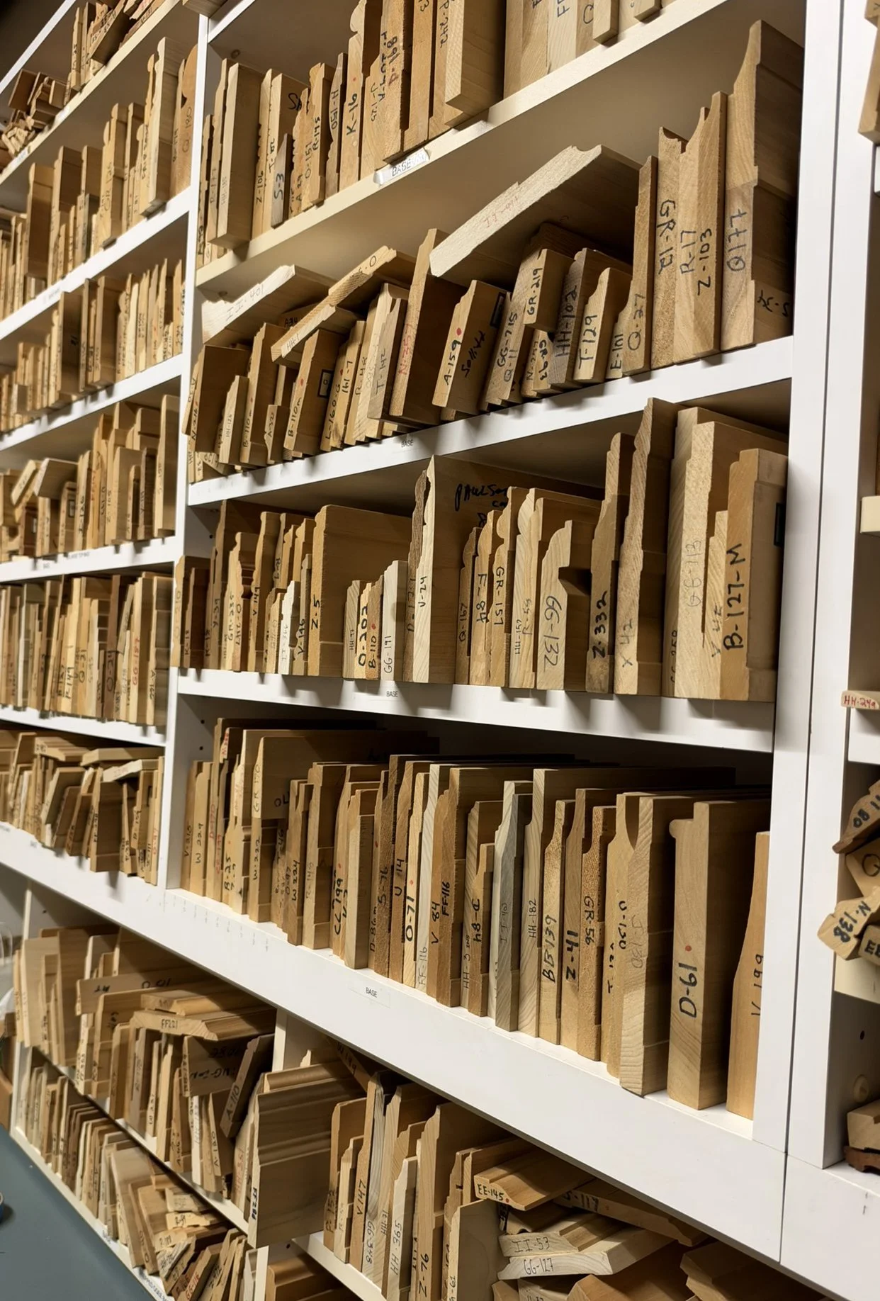 Rows of custom wood moulding profile samples in the O.B. Williams Seattle shop.
