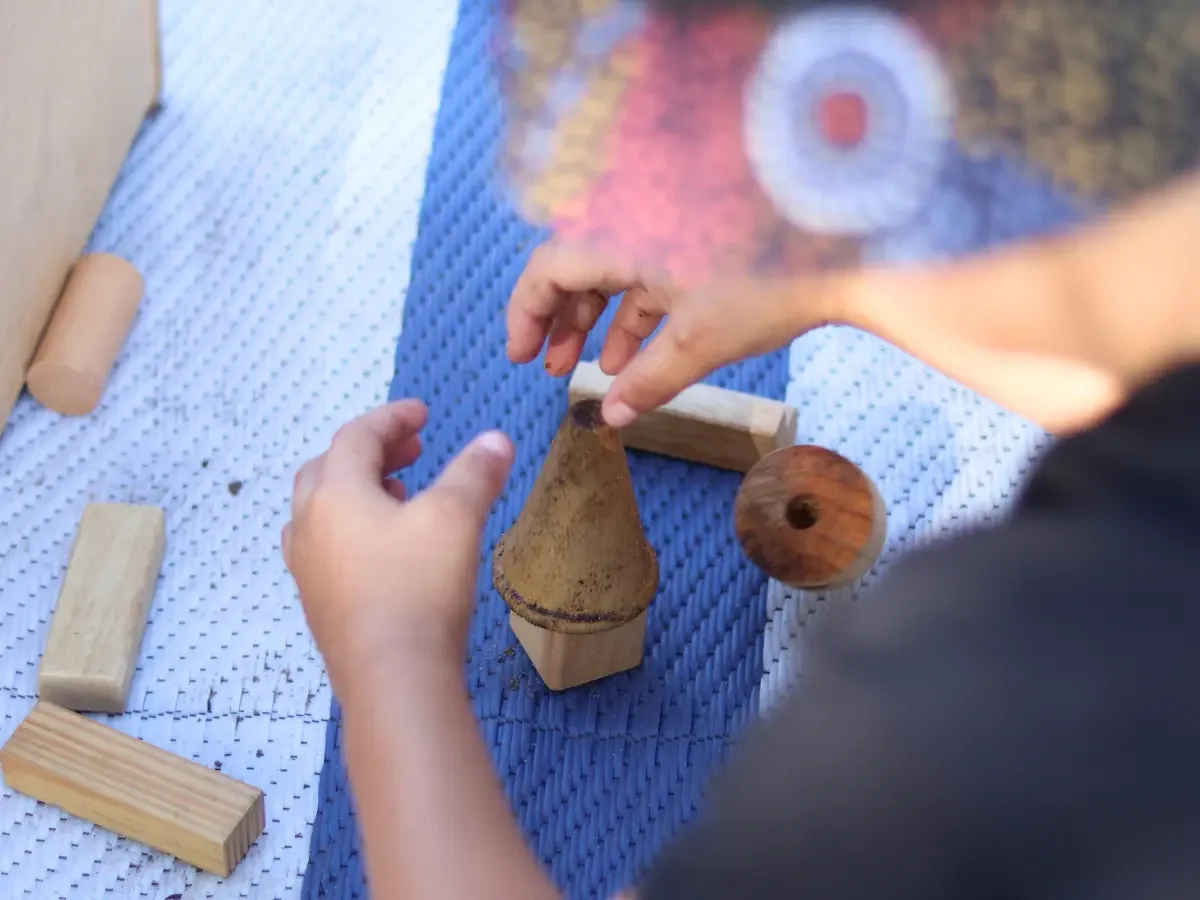 Child building with small construction blocks